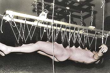 Paul Stolz is pierced and rigged by Vaughn and Joey Wyman for a “flying” horizontal suspension.