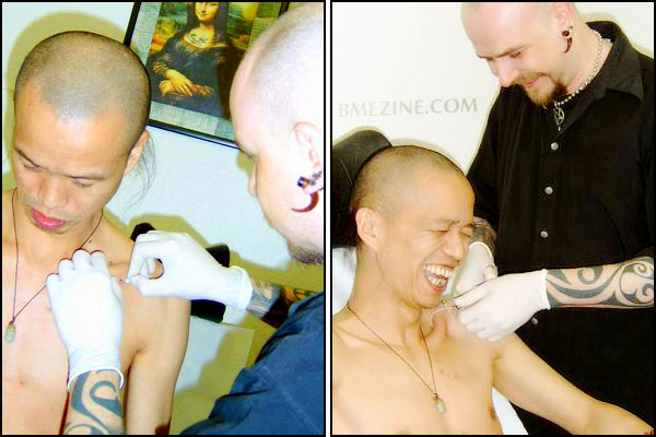 Sub-clavicle piercing beind performed on He Yun Chang by Sarge